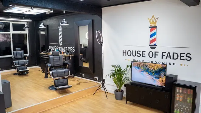 Inside House of Fades: the chair, mirror and logo wall