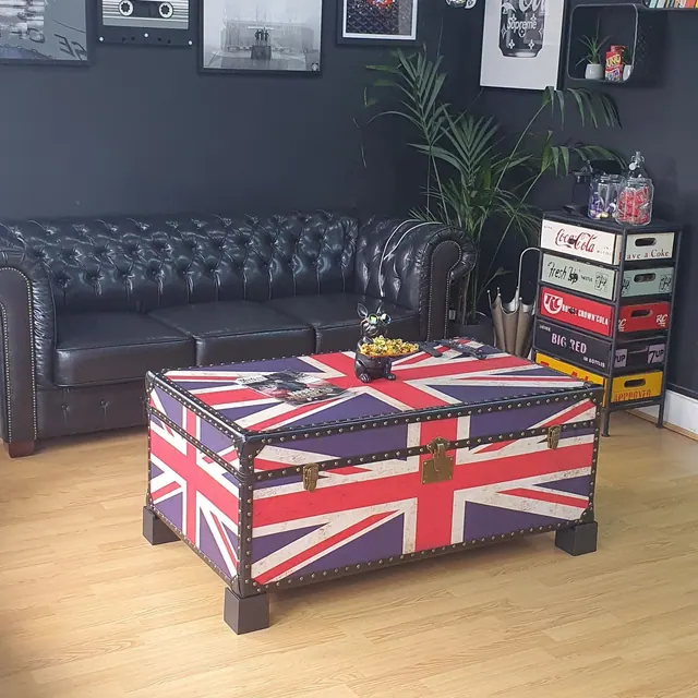 The leather sofa and Union Jack trunk in the waiting area